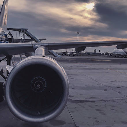 A close of of an aircarft wing and the engine